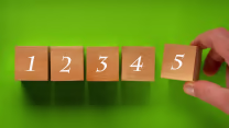 A man is completing a numerical series using reasoning.